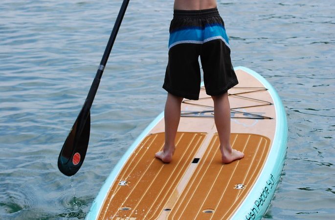 Surfboard vs Paddle Board: A Social Exploration